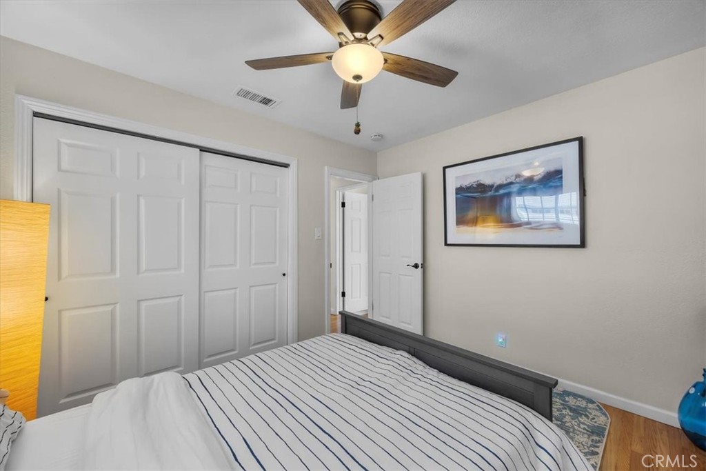 2407 Ripley Avenue Redondo Beach, CA 90278 - Photo 17 of 39 a bedroom with a bed and a chandelier