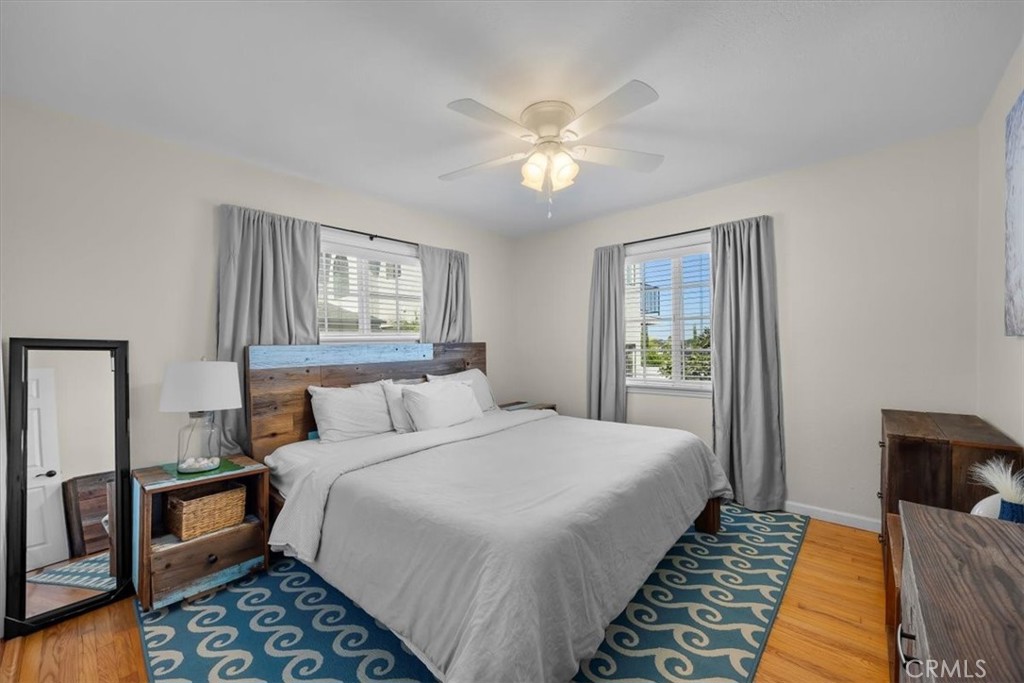 2407 Ripley Avenue Redondo Beach, CA 90278 - Photo 18 of 39 a bedroom with a bed and a chandelier