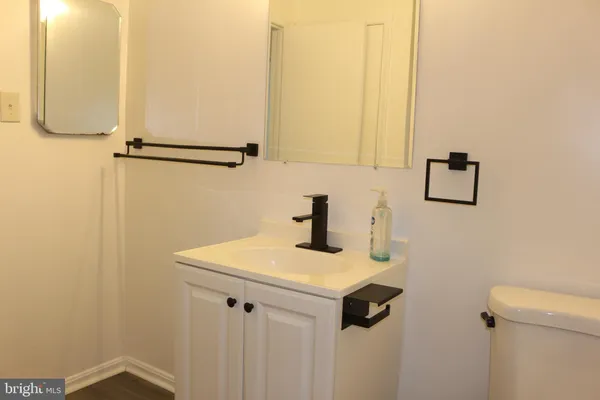 a bathroom with a sink and mirror