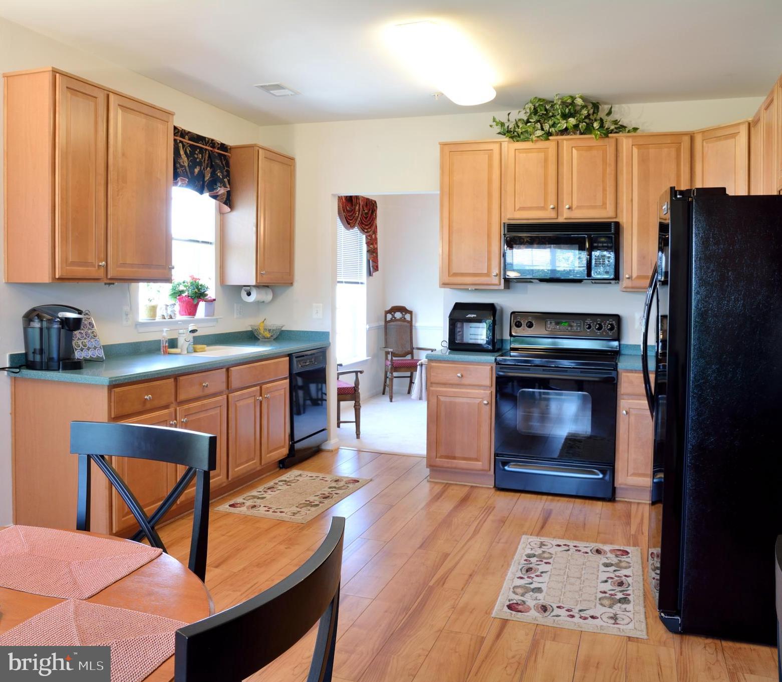 7305 Maplecrest Road, Unit 406 Elkridge, MD 21075 - Photo 13 of 26 Kitchen into Dining Room