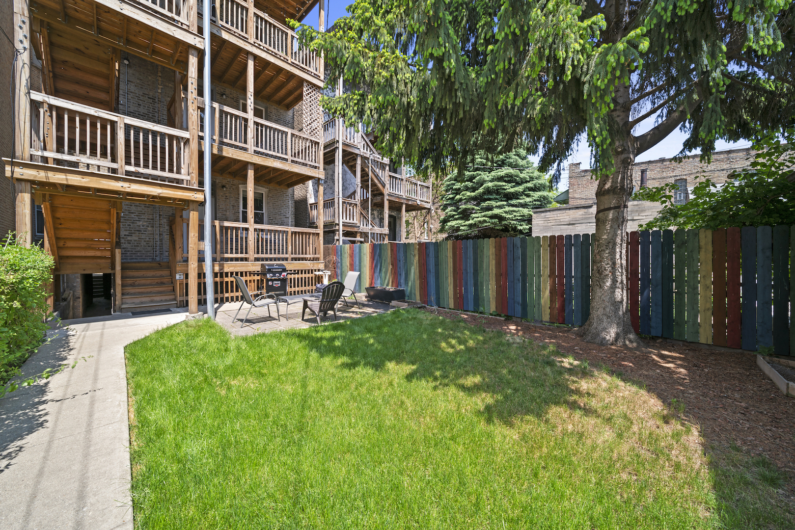 2545 West Walton Street, Unit 2 Chicago, IL 60622 - Photo 11 of 20 a front view of a house with a yard