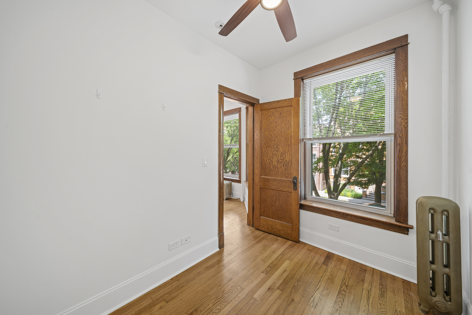 2545 West Walton Street, Unit 2 Chicago, IL 60622 - Photo 17 of 20 an empty room with wooden floor and windows