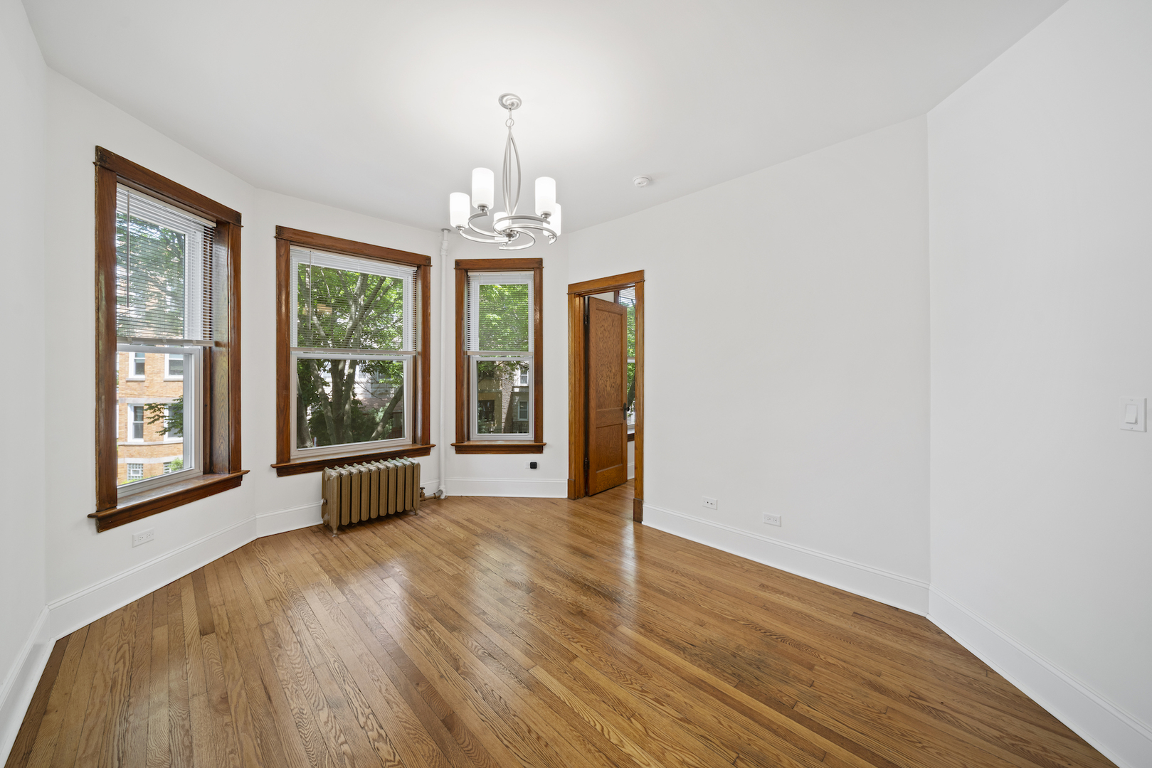 2545 West Walton Street, Unit 2 Chicago, IL 60622 - Photo 2 of 20 a view of livingroom with furniture wooden floor and a window