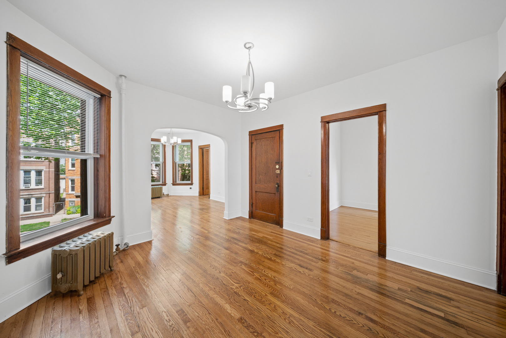 2545 West Walton Street, Unit 2 Chicago, IL 60622 - Photo 4 of 20 a view of a hallway with wooden floor and windows