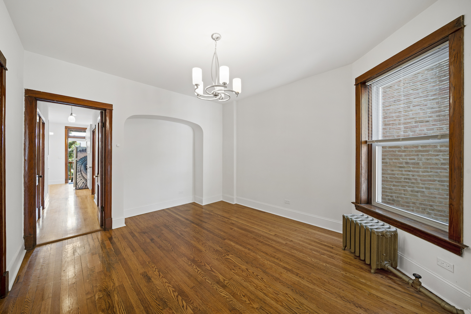2545 West Walton Street, Unit 2 Chicago, IL 60622 - Photo 5 of 20 a view of empty room with wooden floor and fan