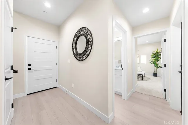 a bed room with a bed and a potted plant