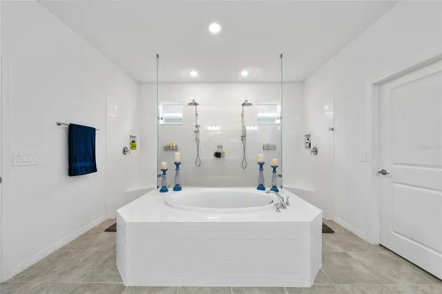 a bathroom with a bathtub and a sink