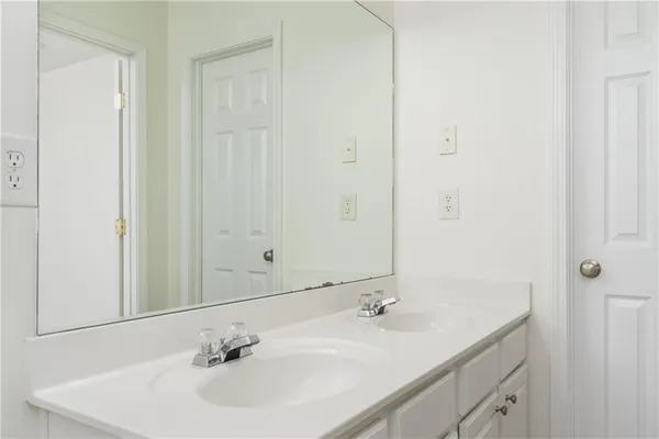 an empty room with a ceiling fan and a window