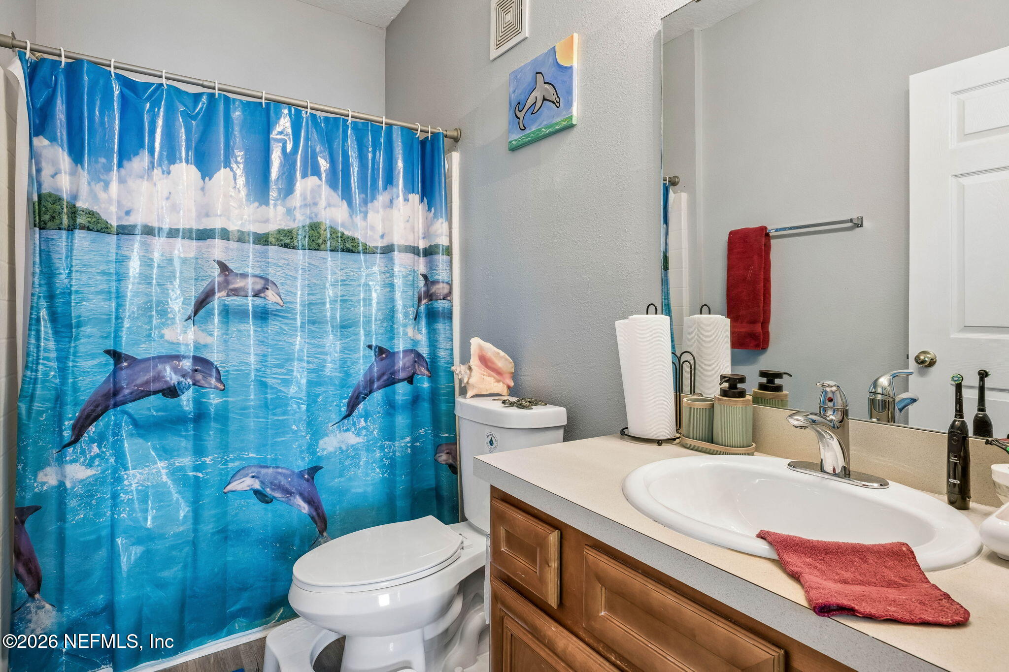 8215 Green Parrot Road, Unit 106 Jacksonville, FL 32256 - Photo 21 of 76 a bathroom with a sink toilet and shower