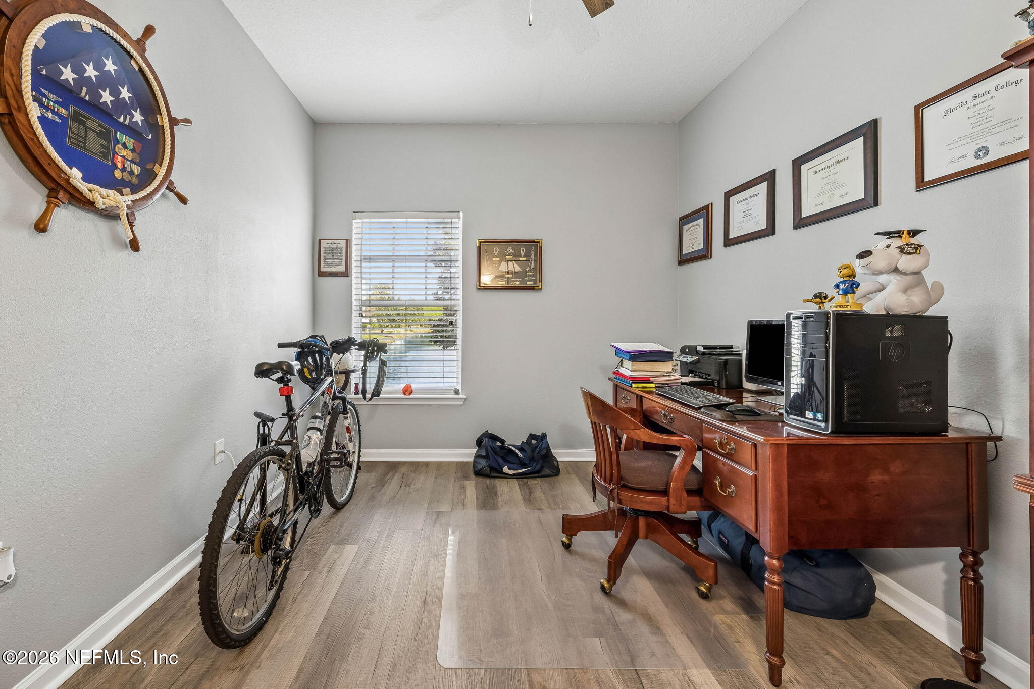 8215 Green Parrot Road, Unit 106 Jacksonville, FL 32256 - Photo 24 of 76 a view of a workspace with furniture and a window