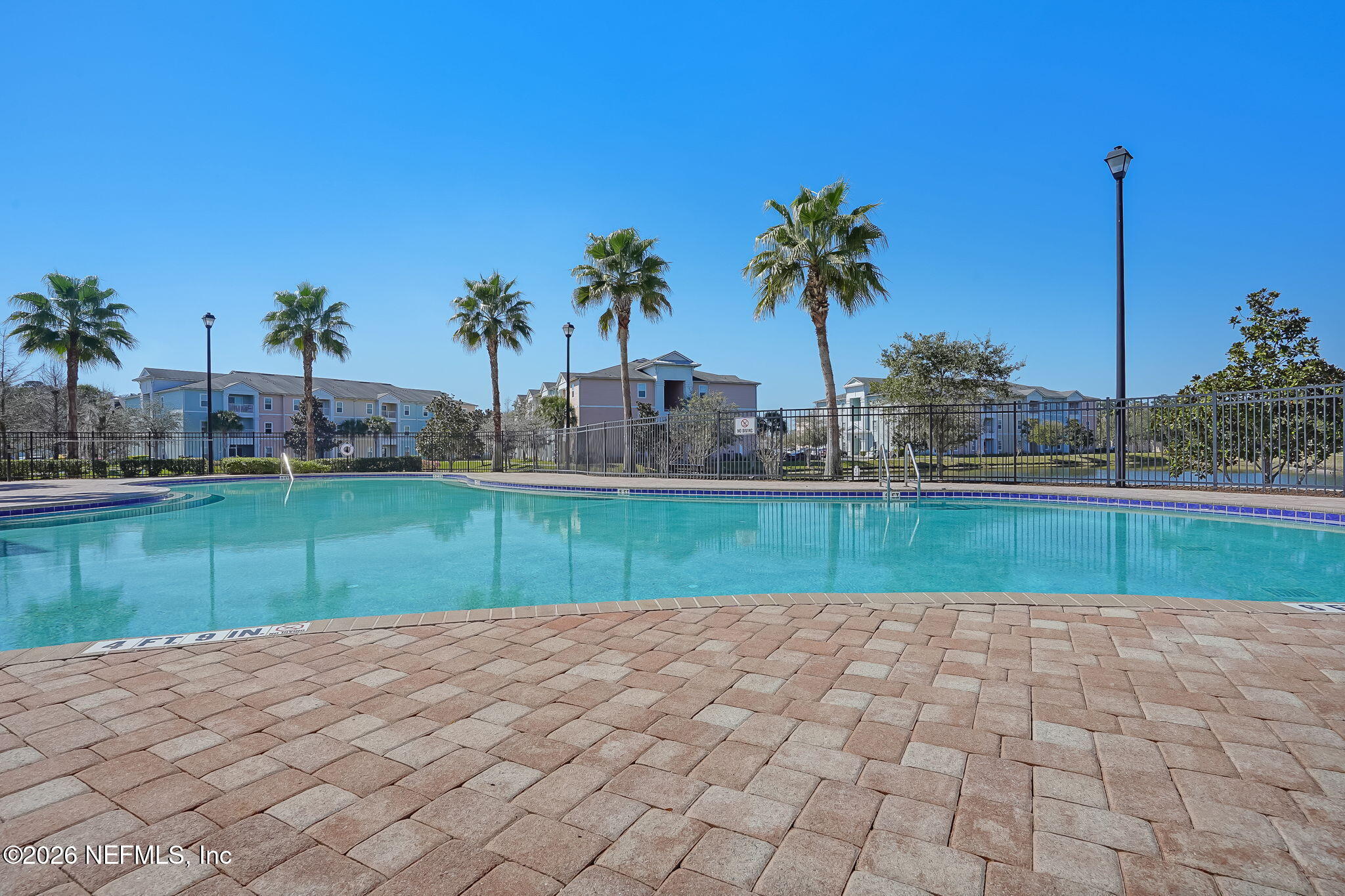 8215 Green Parrot Road, Unit 106 Jacksonville, FL 32256 - Photo 39 of 76 a view of a garden with a small yard and palm trees