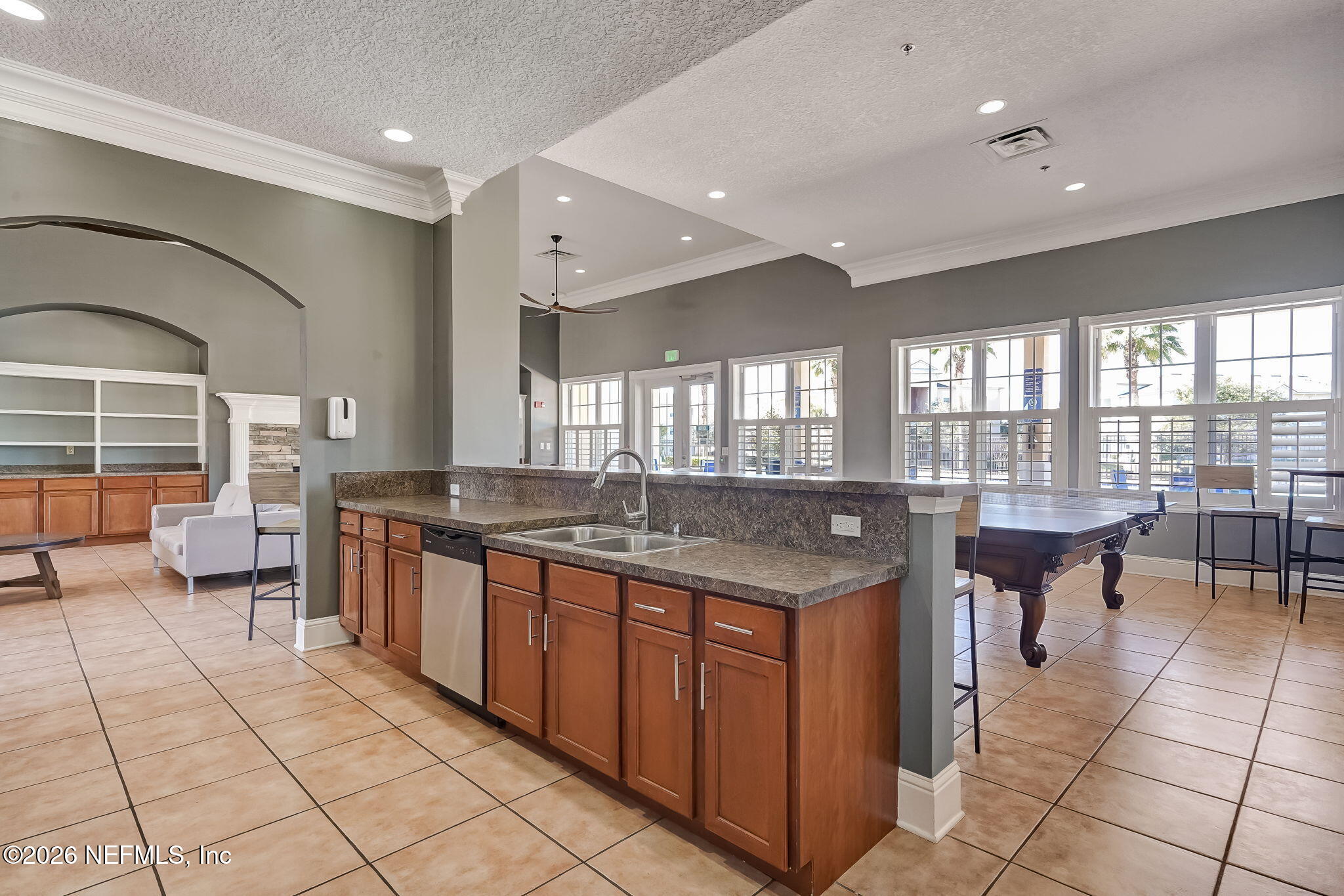 8215 Green Parrot Road, Unit 106 Jacksonville, FL 32256 - Photo 45 of 76 a large kitchen with lots of counter space and dining table