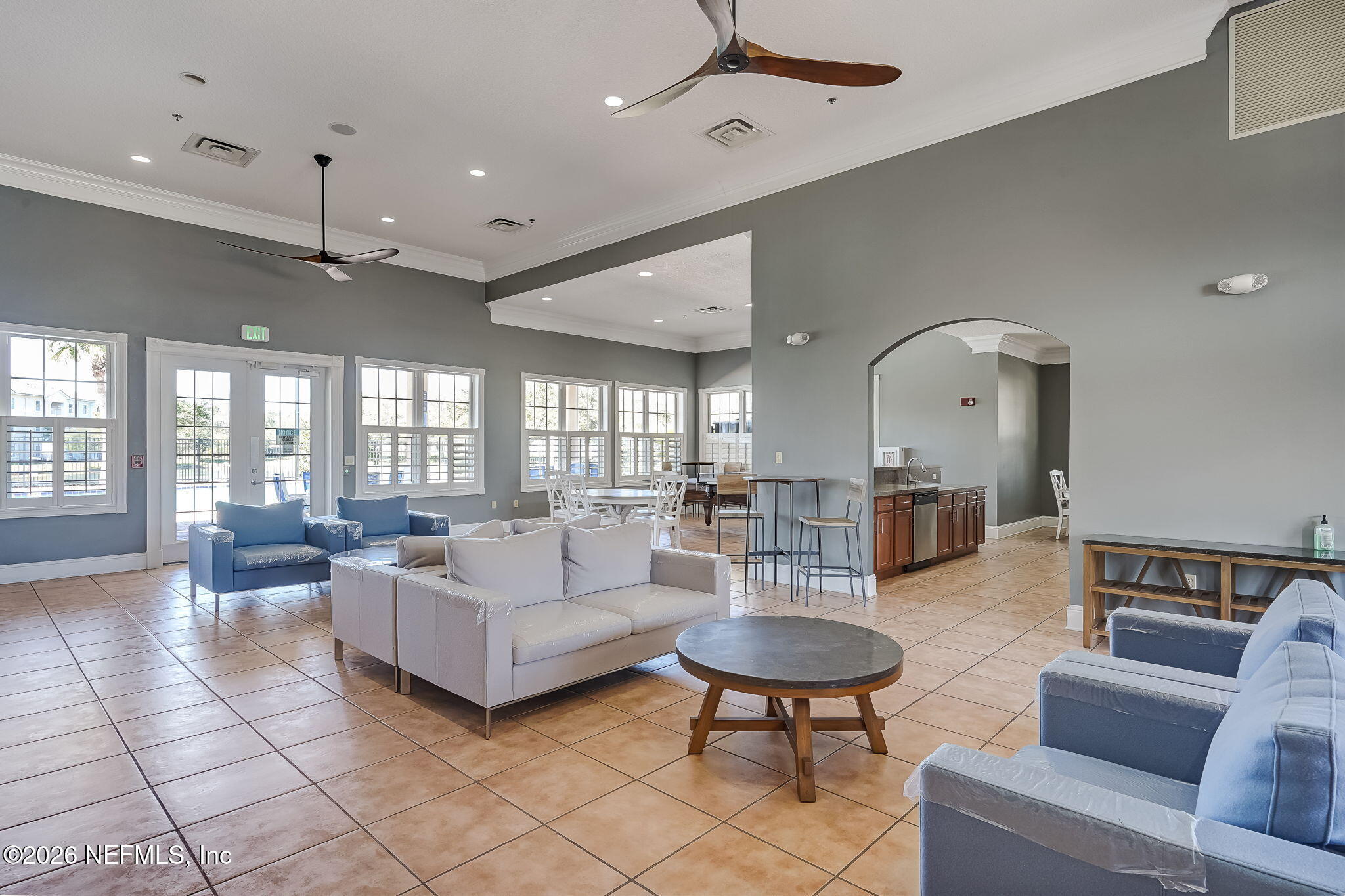 8215 Green Parrot Road, Unit 106 Jacksonville, FL 32256 - Photo 46 of 76 a living room with furniture and a large window