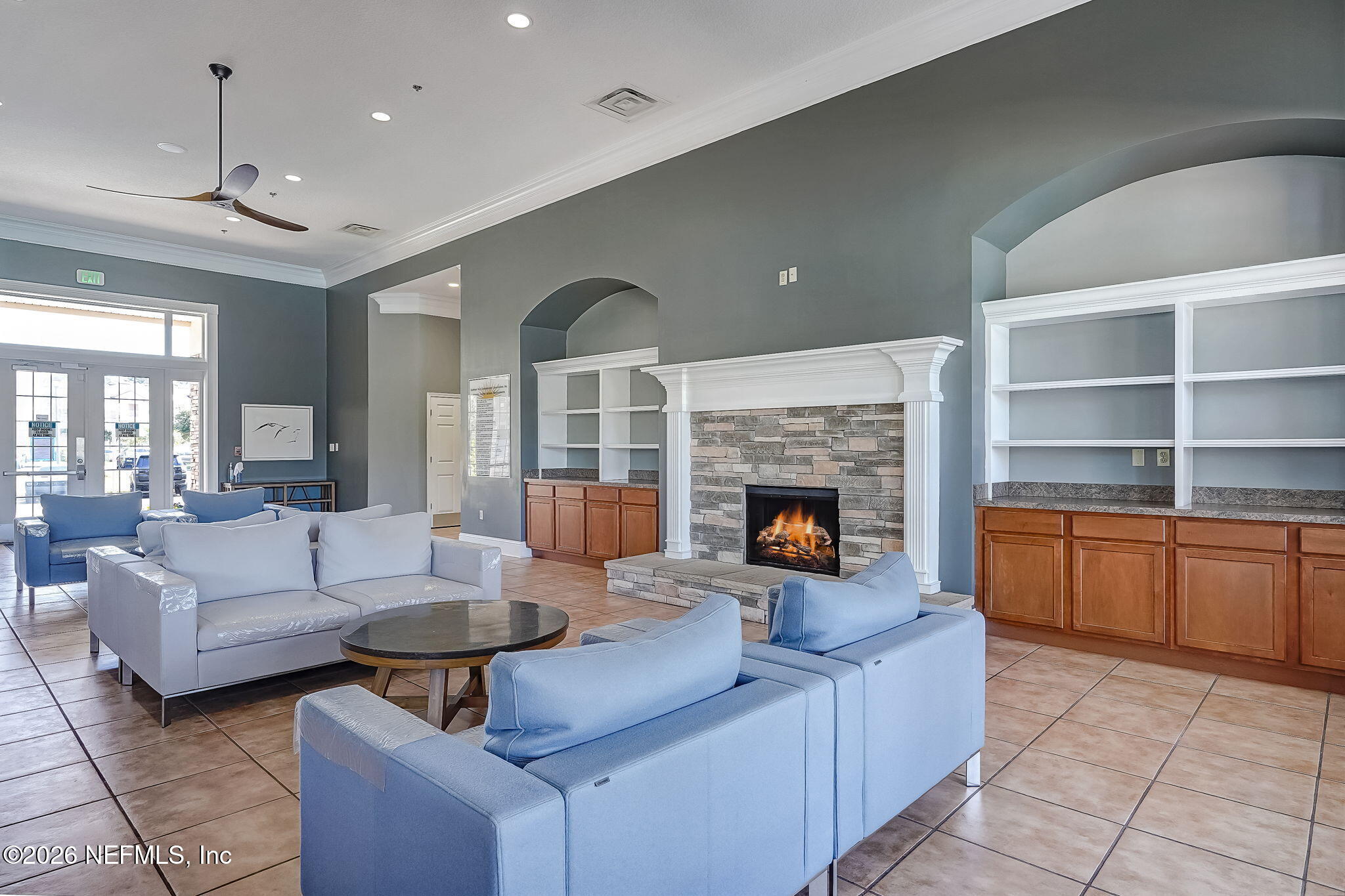 8215 Green Parrot Road, Unit 106 Jacksonville, FL 32256 - Photo 50 of 76 a living room with furniture and a fireplace