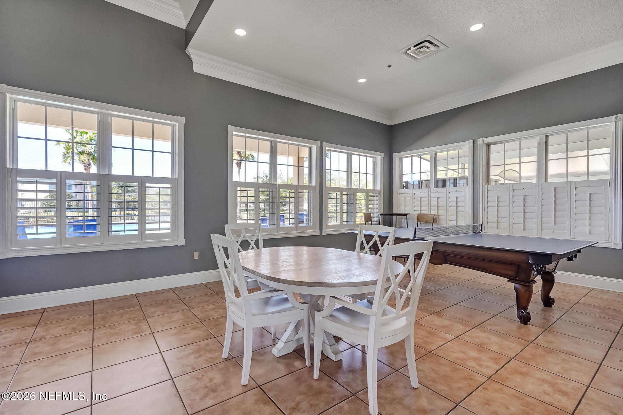 8215 Green Parrot Road, Unit 106 Jacksonville, FL 32256 - Photo 54 of 76 a dining room with furniture and windows