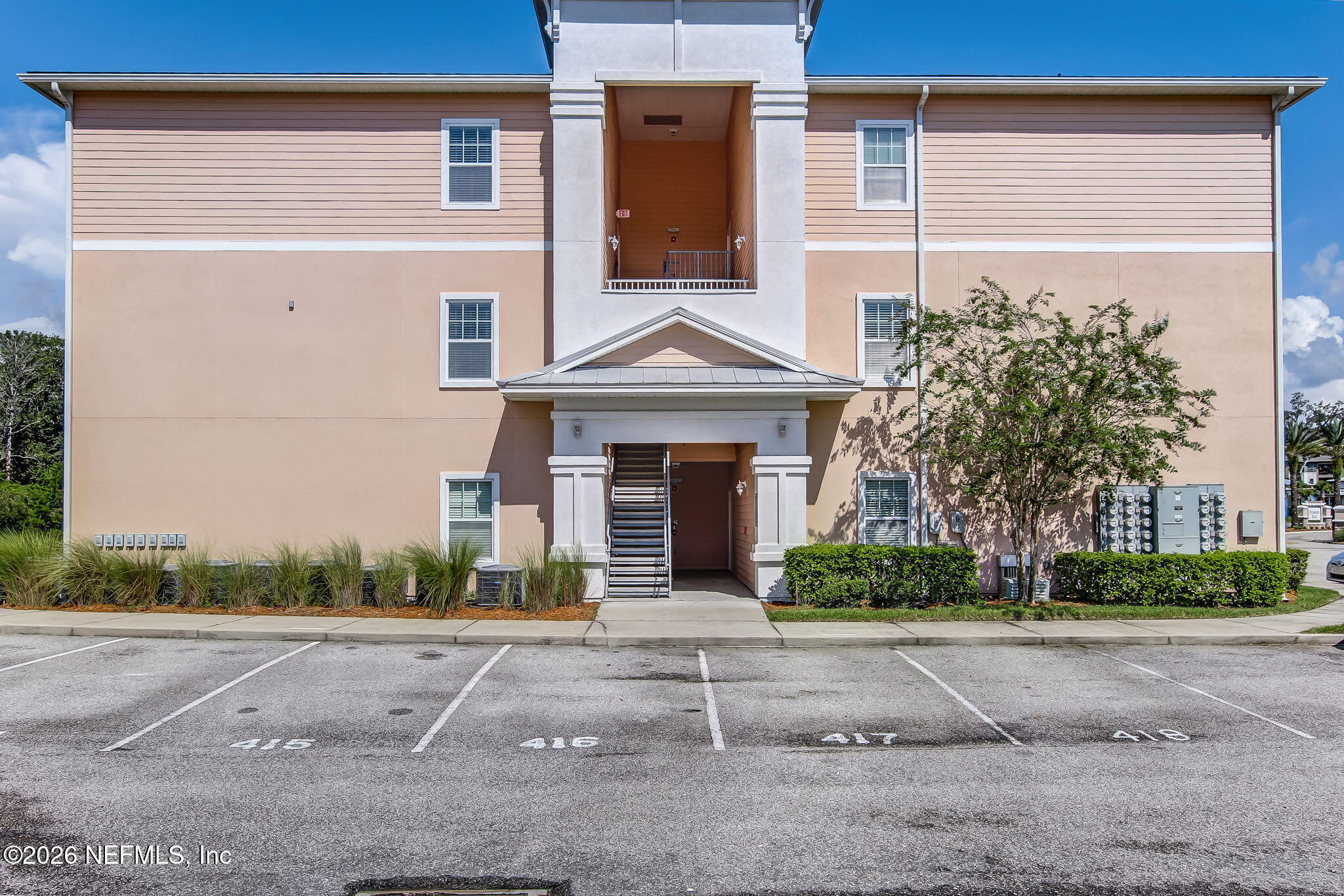 8215 Green Parrot Road, Unit 106 Jacksonville, FL 32256 - Photo 68 of 76 front view of a house with a yard
