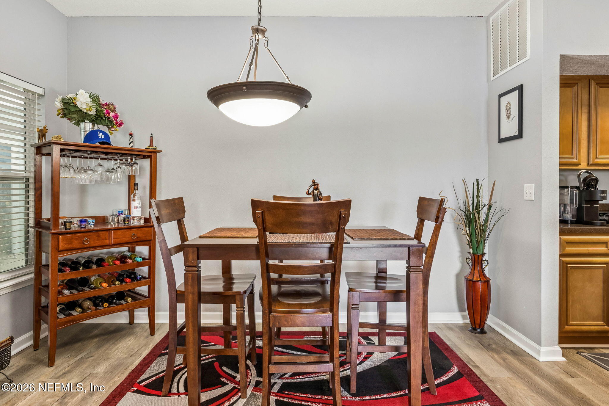 8215 Green Parrot Road, Unit 106 Jacksonville, FL 32256 - Photo 8 of 76 a view of a dining room with furniture and a window