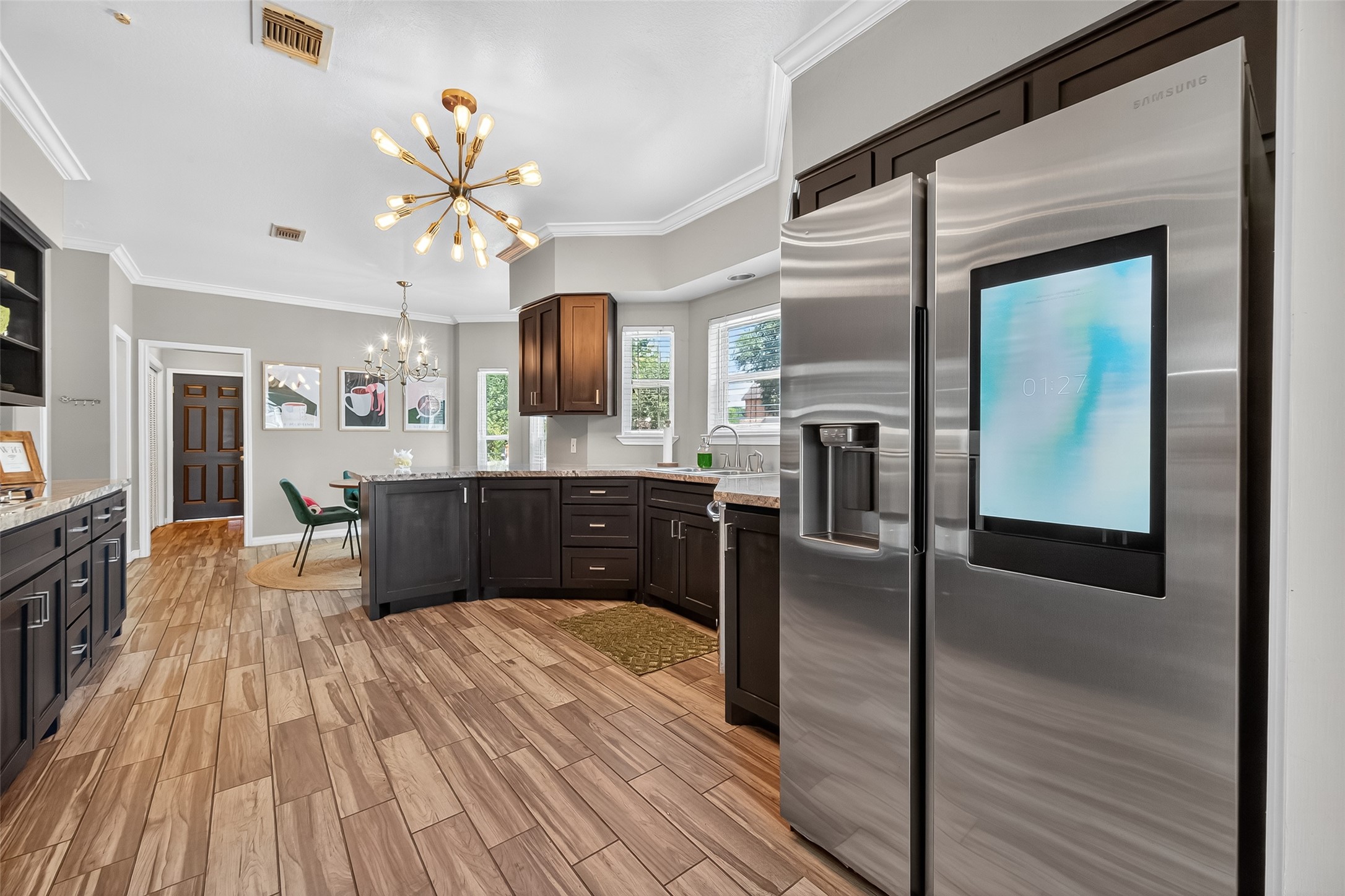 5310 Holly View Drive Houston, TX 77091 - Photo 14 of 38 a kitchen with granite countertop a refrigerator a sink dishwasher and a oven with wooden floor
