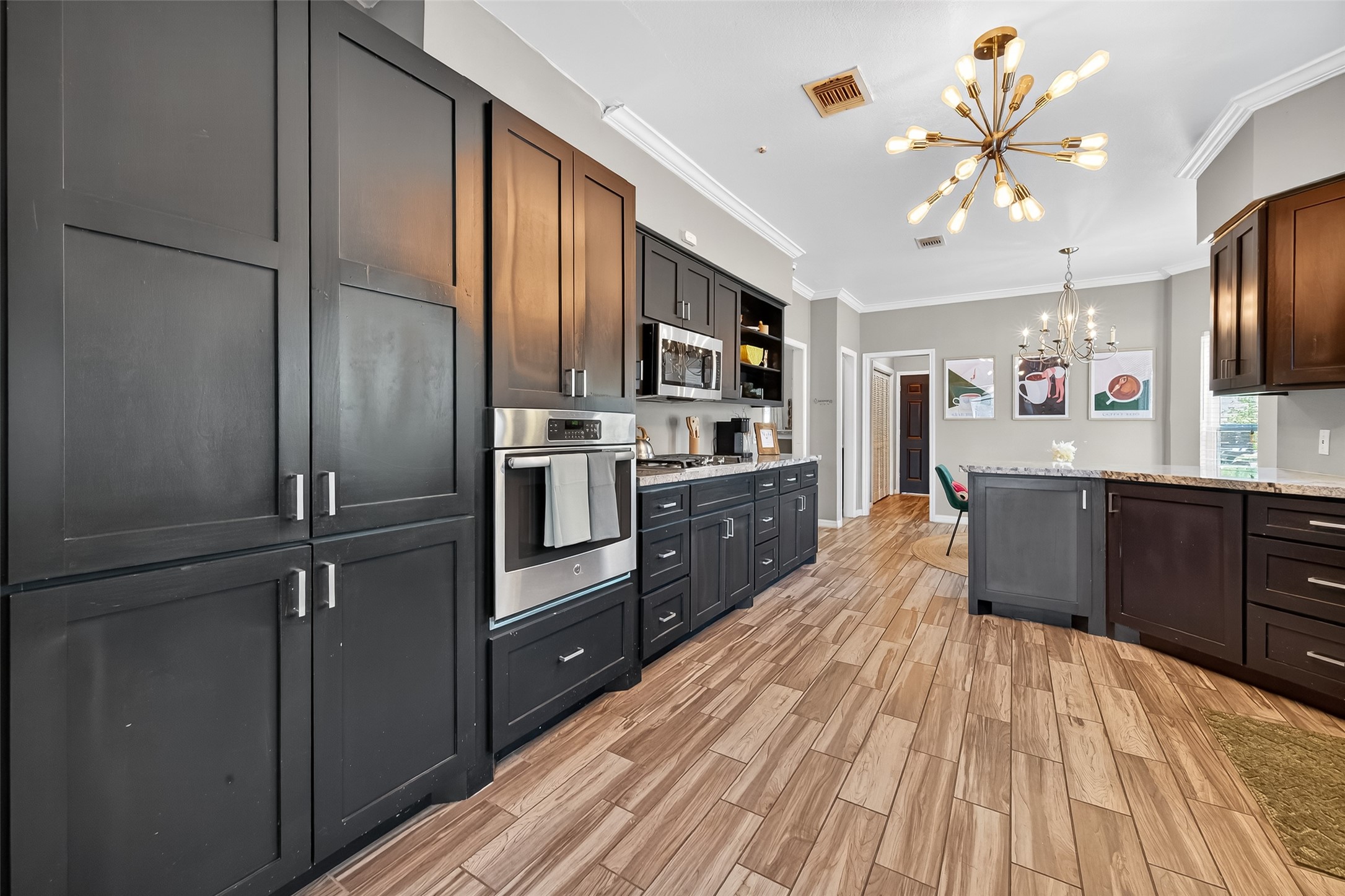 5310 Holly View Drive Houston, TX 77091 - Photo 15 of 38 a kitchen with stainless steel appliances a sink cabinets and wooden floor