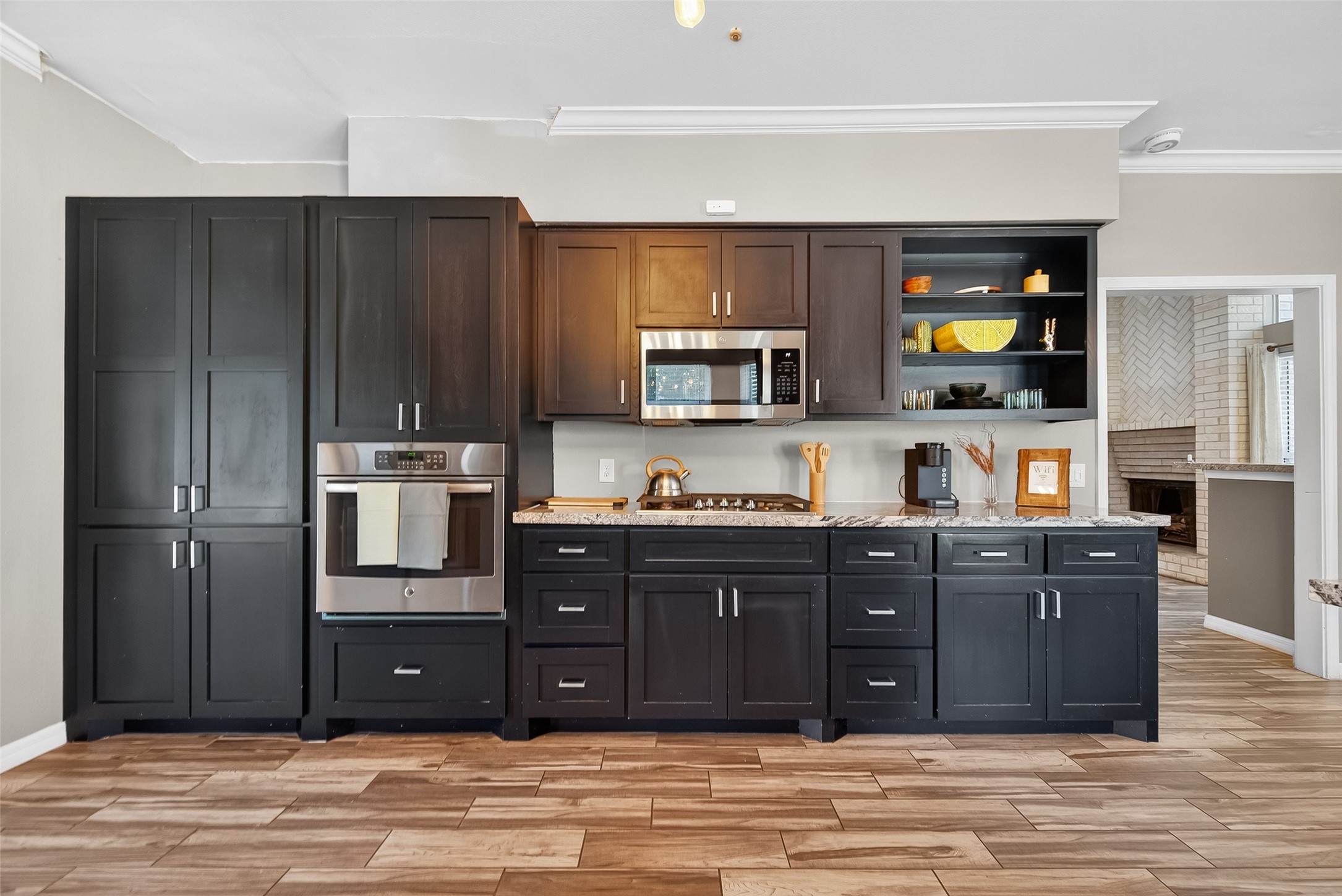 5310 Holly View Drive Houston, TX 77091 - Photo 18 of 38 a kitchen with stainless steel appliances granite countertop wooden cabinets and a sink