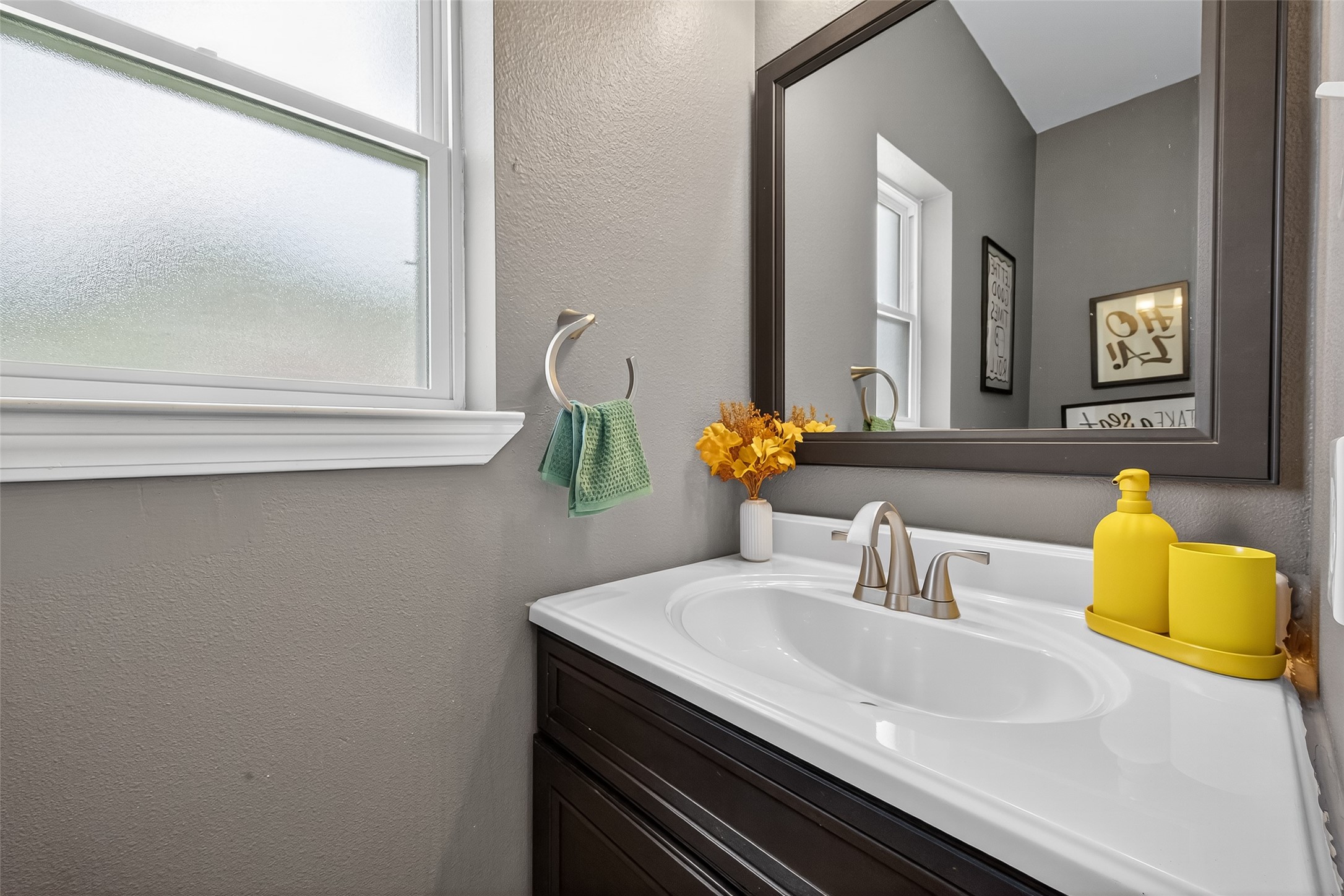 5310 Holly View Drive Houston, TX 77091 - Photo 20 of 38 a bathroom with a sink and a mirror