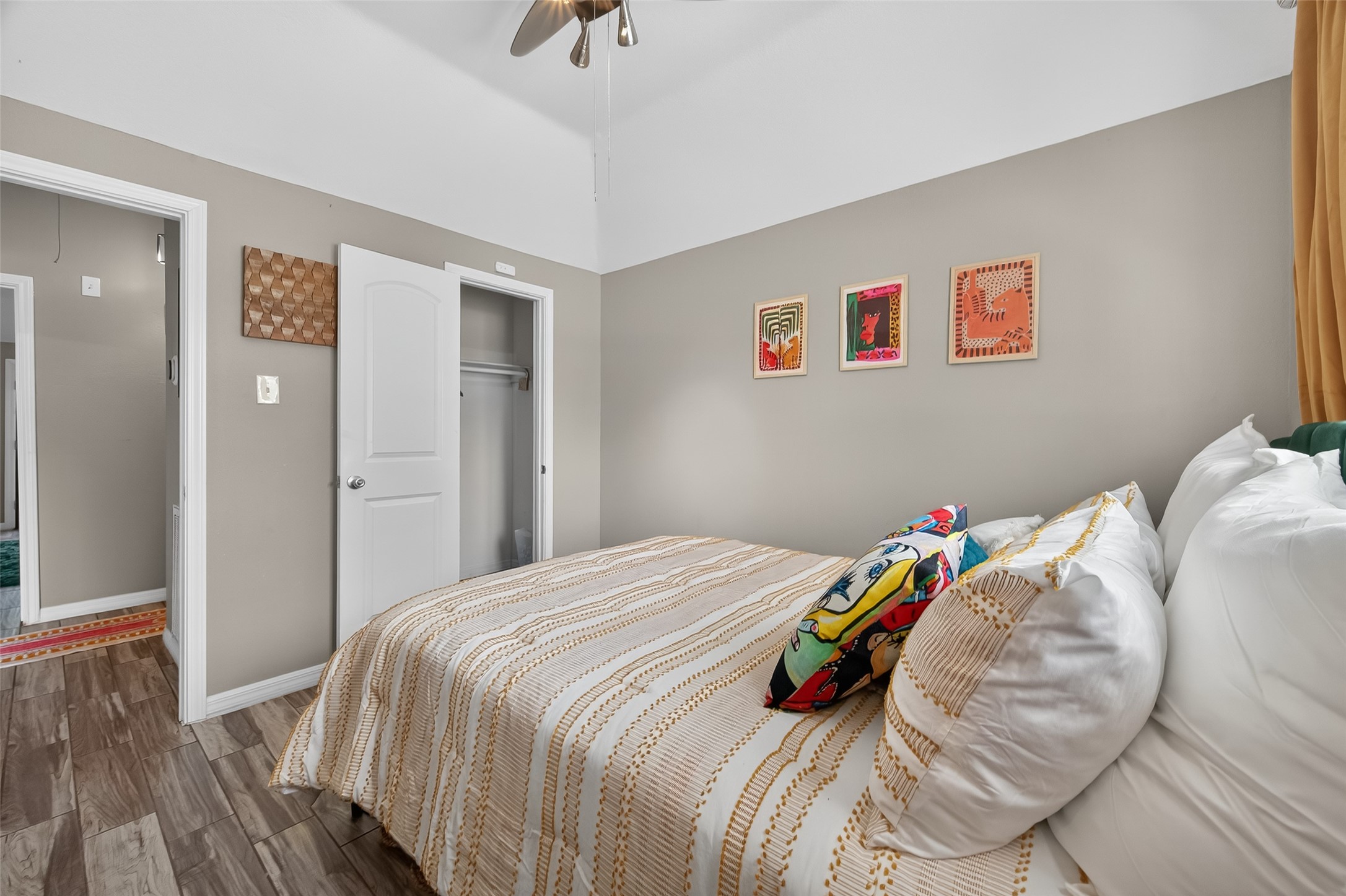 5310 Holly View Drive Houston, TX 77091 - Photo 22 of 38 a bedroom with a bed and a wooden floor