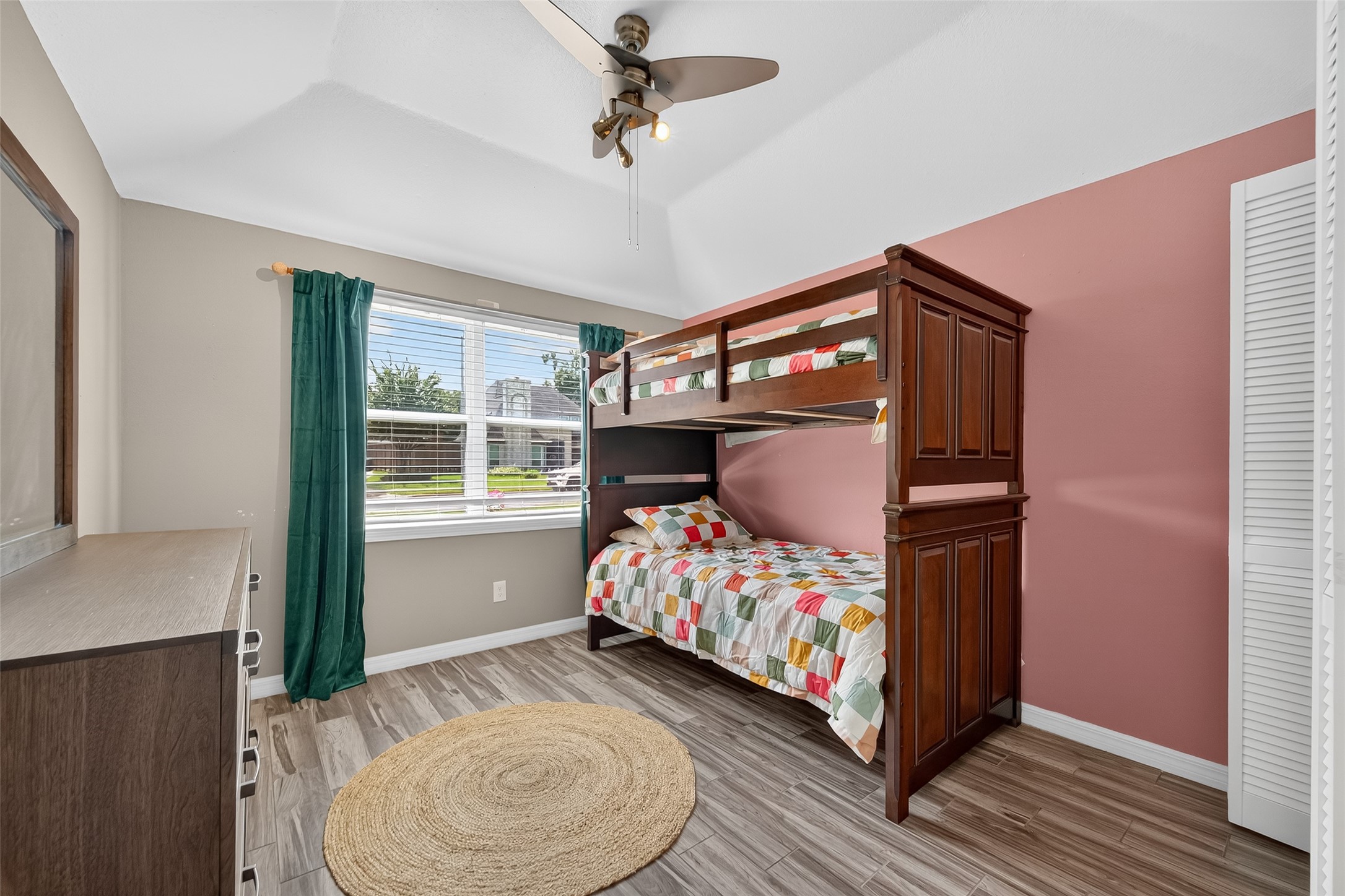 5310 Holly View Drive Houston, TX 77091 - Photo 23 of 38 a bedroom with bed and wooden floor