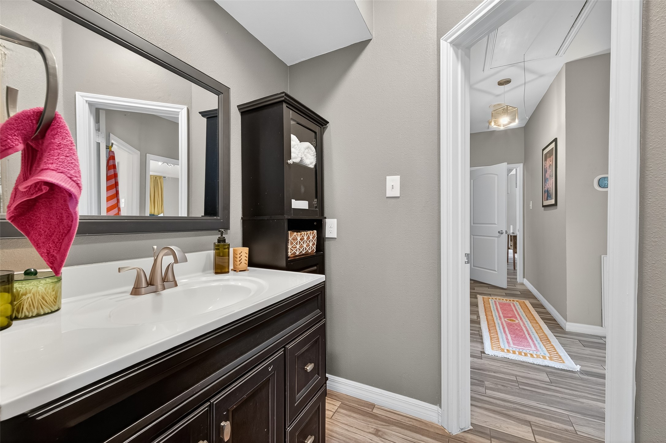 5310 Holly View Drive Houston, TX 77091 - Photo 26 of 38 a bathroom with a sink and a mirror