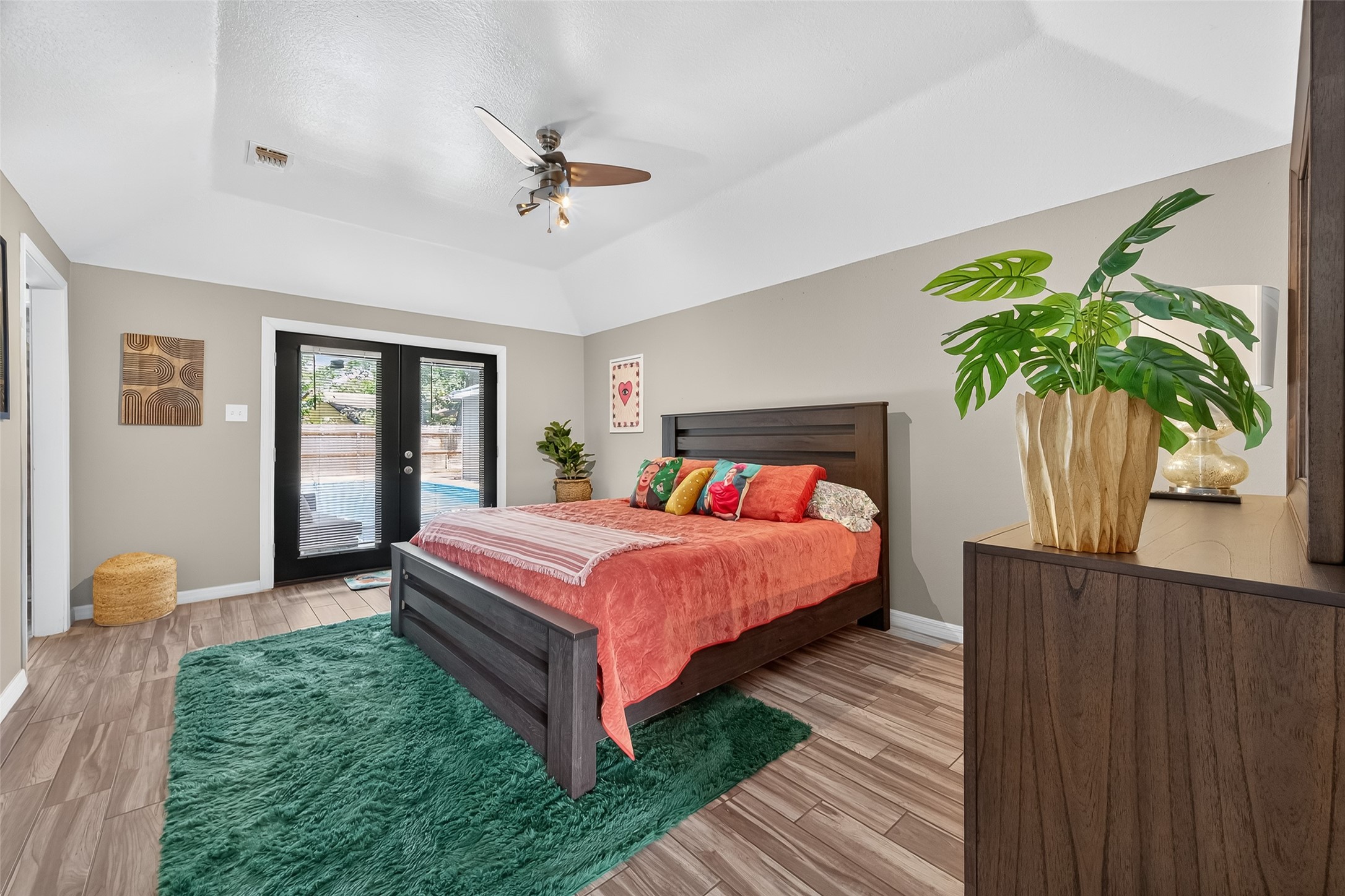 5310 Holly View Drive Houston, TX 77091 - Photo 27 of 38 a bedroom with bed and a potted plant