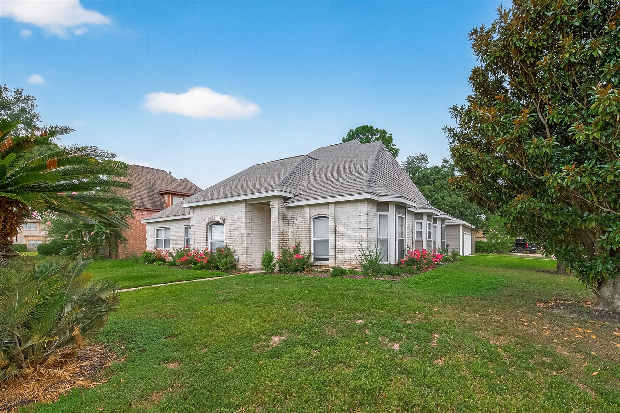 5310 Holly View Drive Houston, TX 77091 - Photo 37 of 38 a white house with a big yard plants and large trees