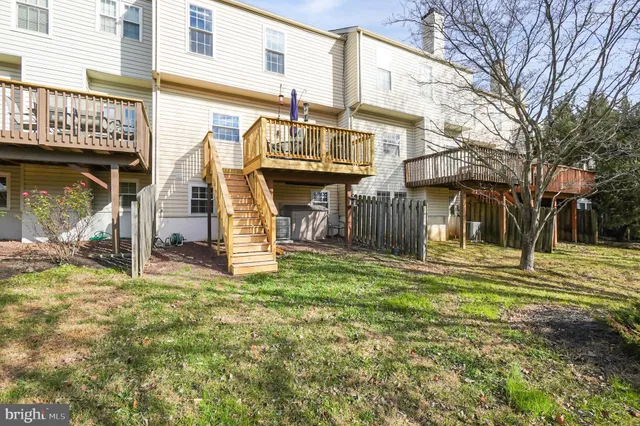 a view of a house with a yard porch and furniture