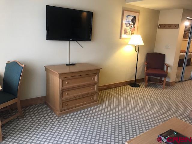 6 Emmons Road, Unit 268 Crested Butte, CO 81225 - Photo 6 of 13 a room with a chair and flat screen tv