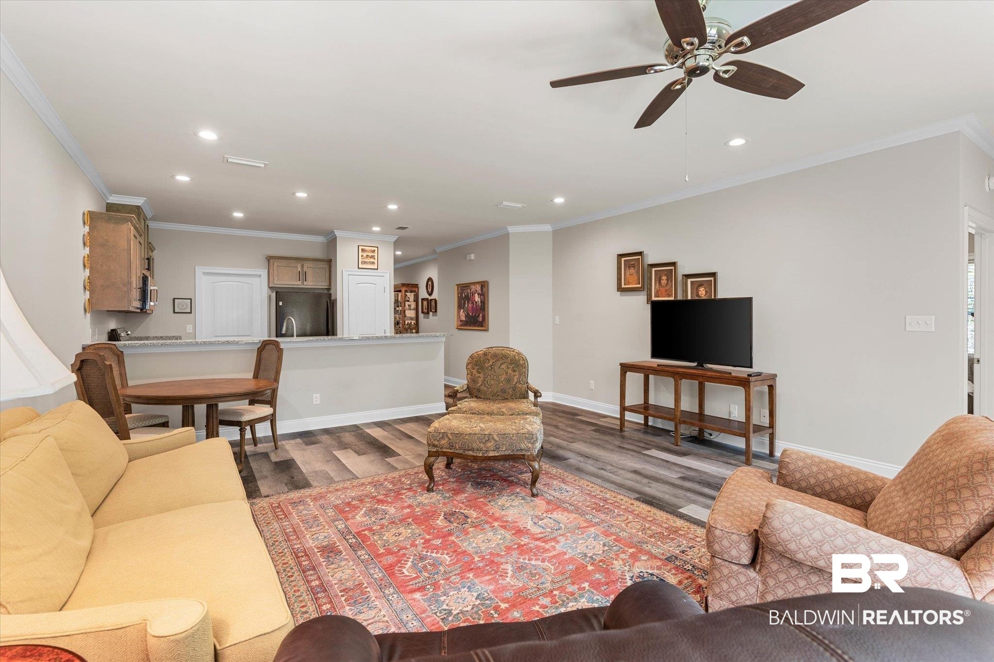 1101 Pinemont Drive Mobile, AL 36609 - Photo 4 of 18 Living area with crown molding, a ceiling fan, wood finished floors, and recessed lighting