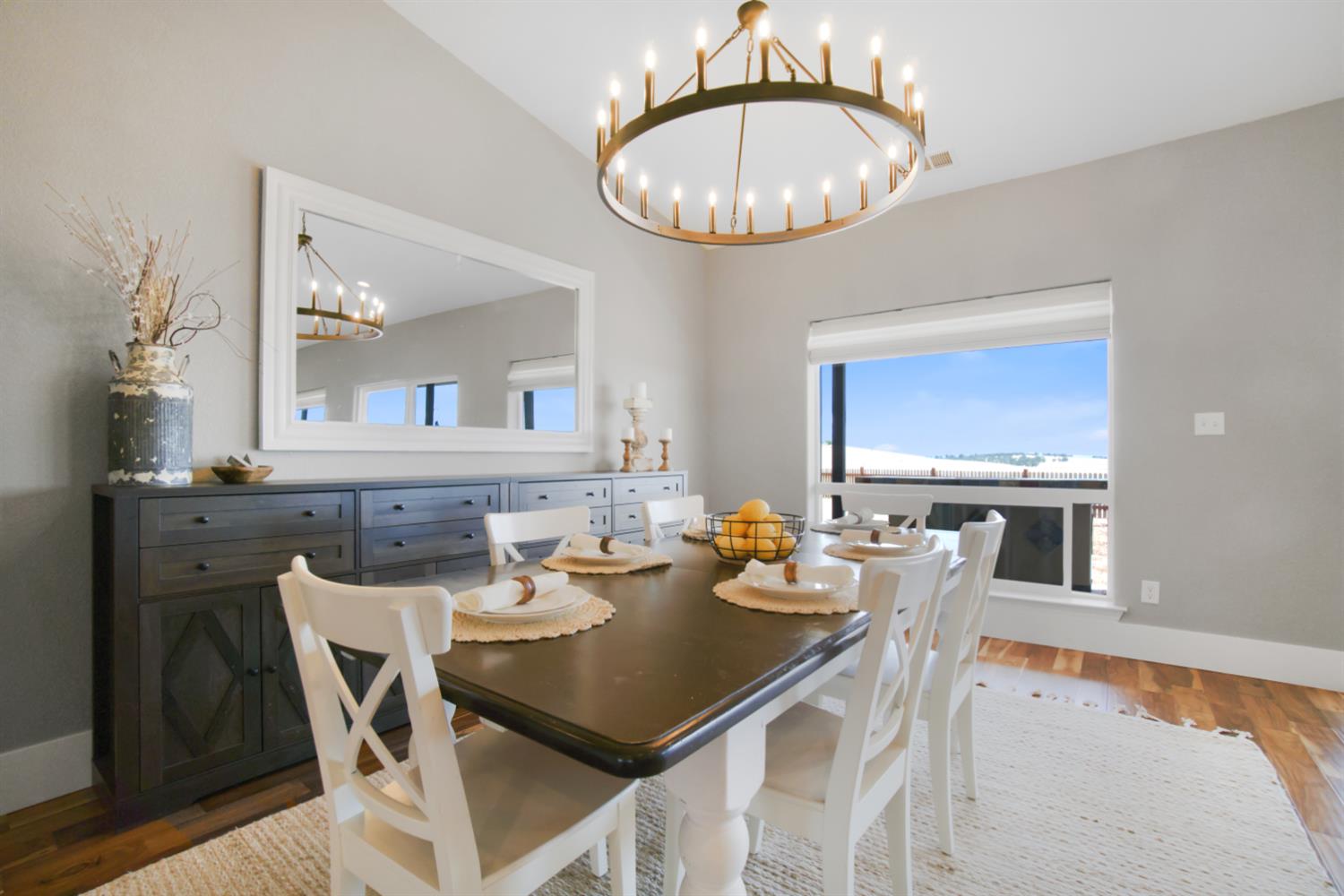 7991 South Shingle Road Shingle Springs, CA 95682 - Photo 13 of 58 a view of a dining room with furniture a chandelier and wooden floor