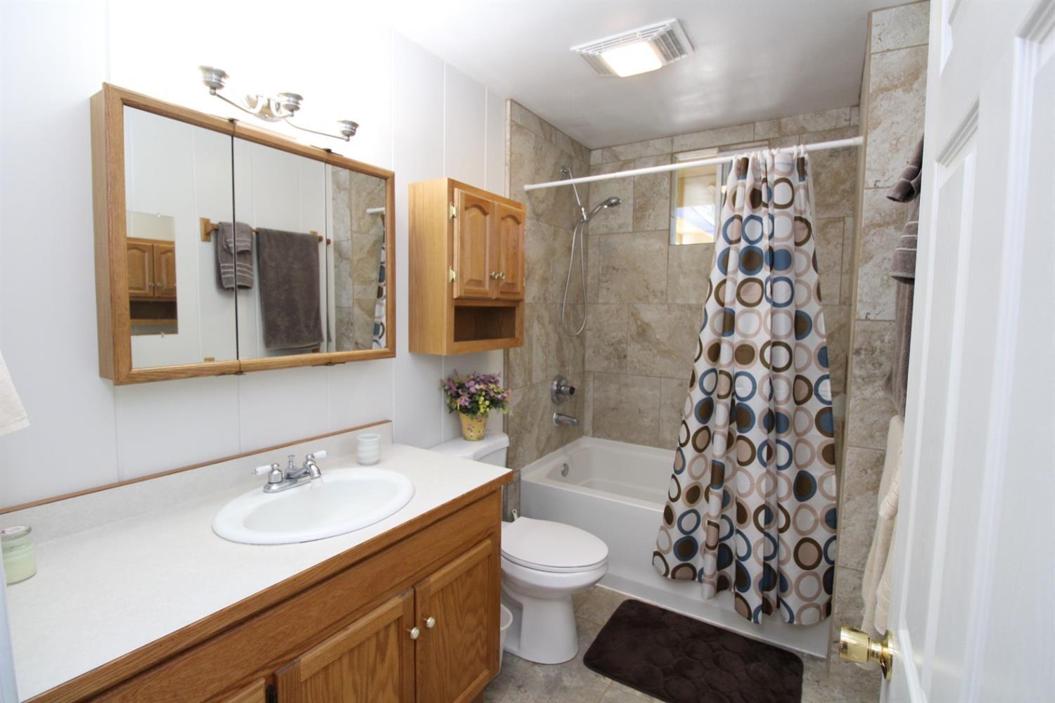 8775 North Applegate Road Grants Pass, OR 97527 - Photo 16 of 31 a bathroom with a sink and a mirror