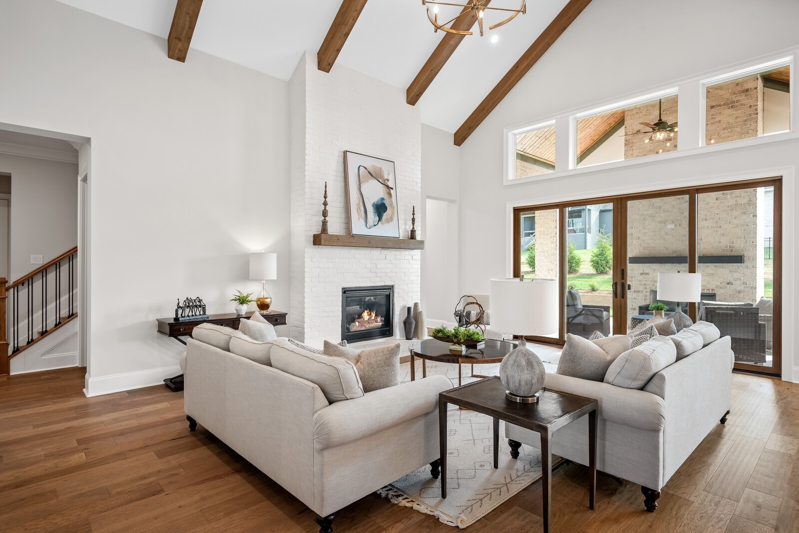 7265 Ruzek Court Fairview, TN 37062 - Photo 15 of 60 a living room with furniture a fireplace and a large window