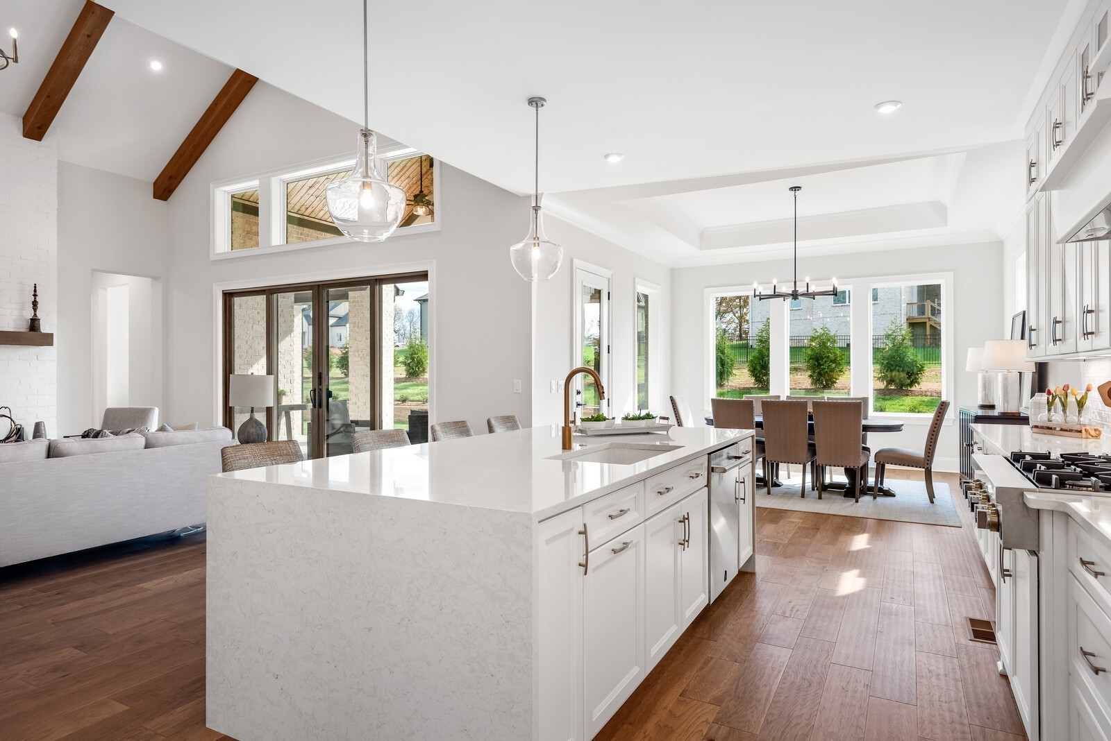 7265 Ruzek Court Fairview, TN 37062 - Photo 27 of 60 a large kitchen with kitchen island a large counter space a sink a window and stainless steel appliances
