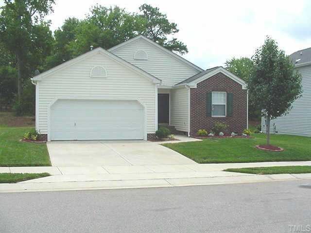 4136 Mantua Way Raleigh, NC 27604 - Photo 1 of 1 a front view of a house with a yard and garage