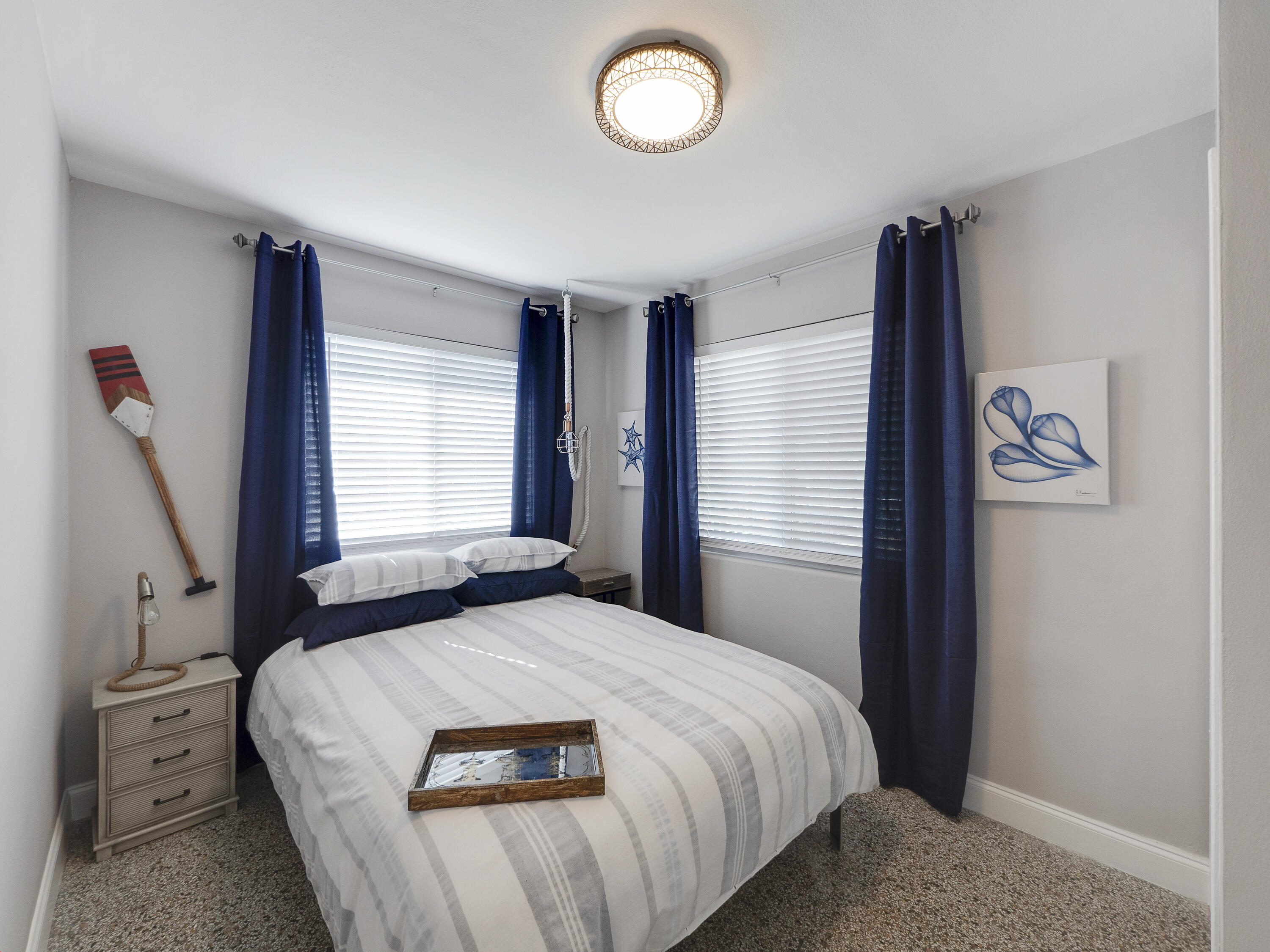 1258 Beach Road, Unit 6 Singer Island, FL 33404 - Photo 6 of 12 a bedroom with a bed and a window