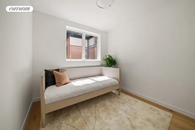 a living room with a couch and a window