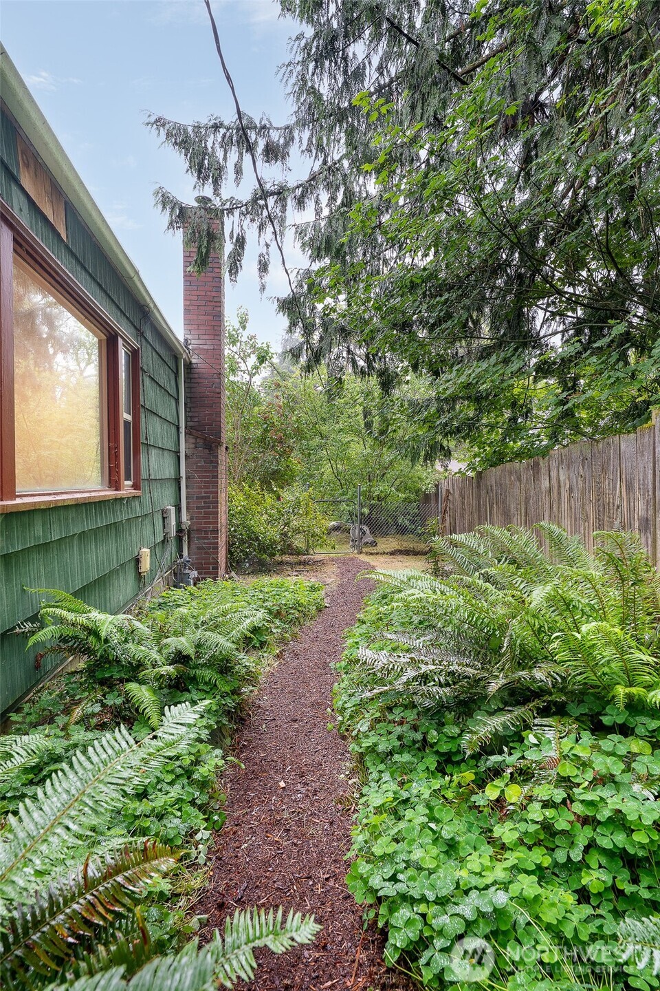 17633 10th Avenue Northeast Shoreline, WA 98155 - Photo 27 of 33 a front view of a house with garden