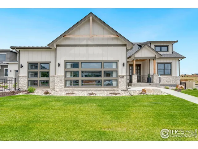 a front view of a house with a yard and porch