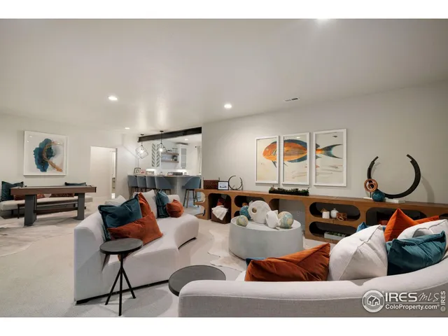 a living room with furniture and a table