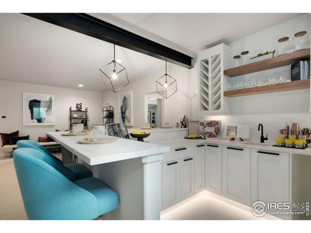 a kitchen with a sink a stove and cabinets