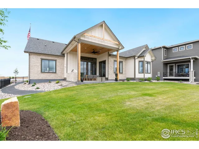 a front view of house with yard and outdoor seating