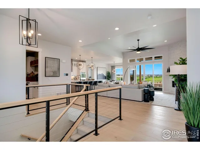 a living room with furniture and a view of kitchen