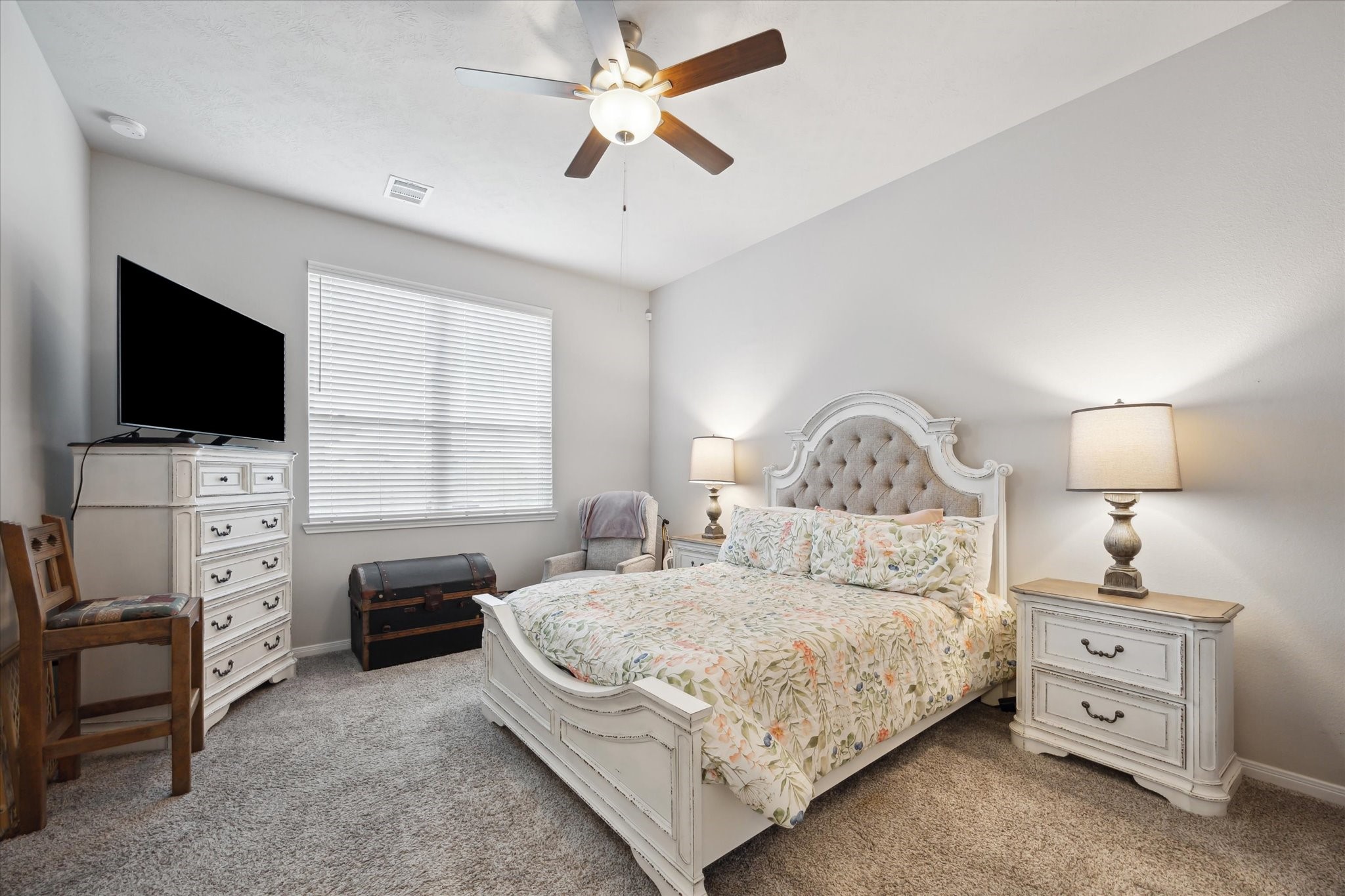 1010 Old Vine Road Brenham, TX 77833 - Photo 14 of 20 a bedroom with a bed and a flat screen tv
