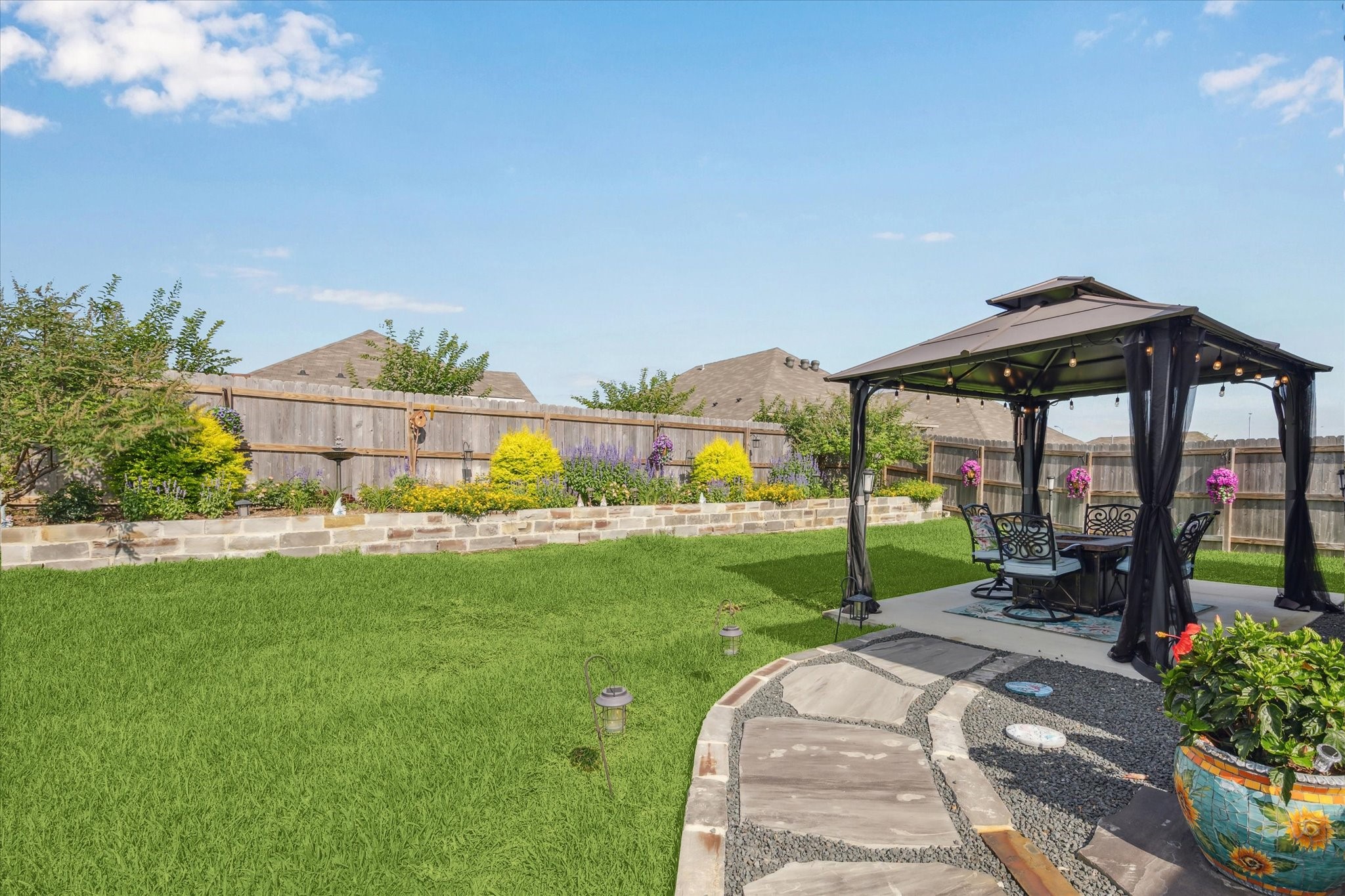 1010 Old Vine Road Brenham, TX 77833 - Photo 17 of 20 a view of a backyard with sitting area