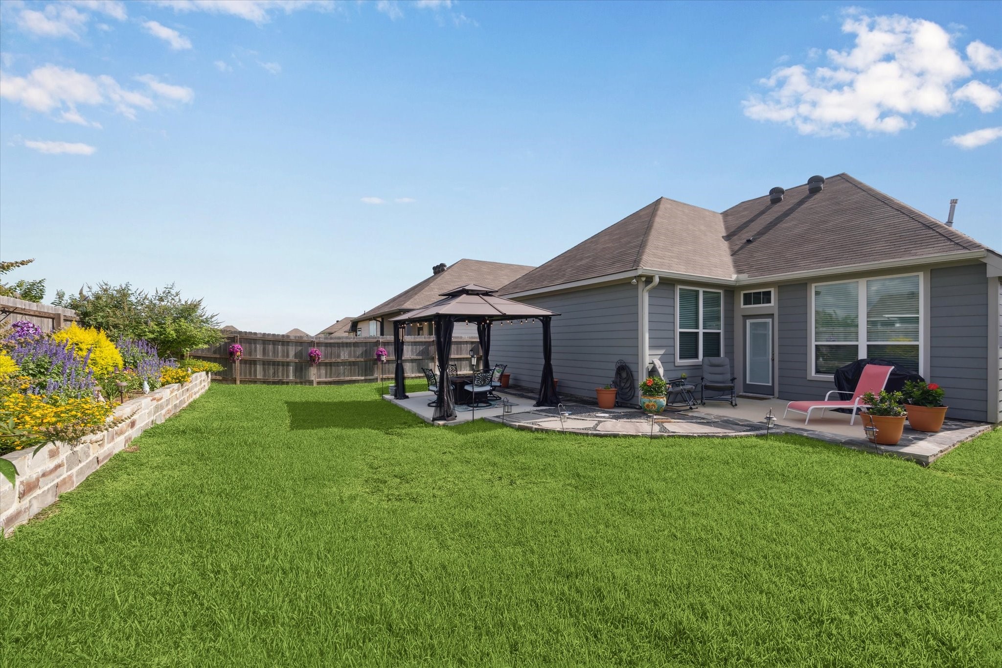 1010 Old Vine Road Brenham, TX 77833 - Photo 19 of 20 a view of a house with a yard and sitting area