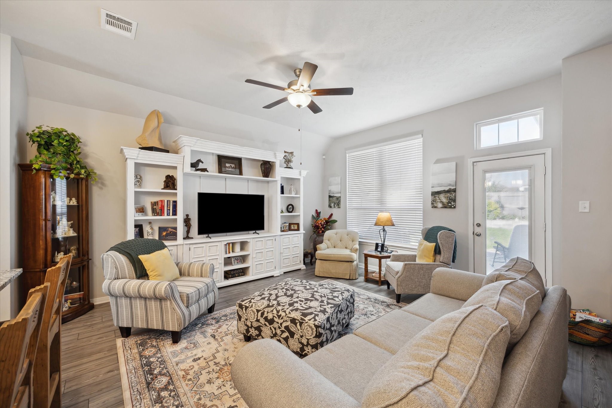 1010 Old Vine Road Brenham, TX 77833 - Photo 5 of 20 a living room with furniture ceiling fan and a flat screen tv